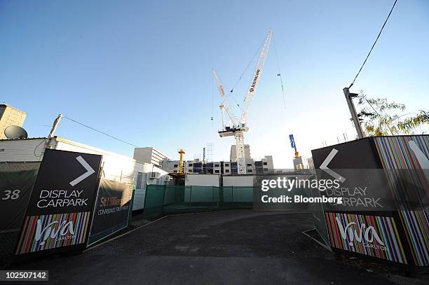 Construction cranes operate on the building site of the Viva Carlton luxury apartment development in Carlton, an inner suburb of Melbourne,...