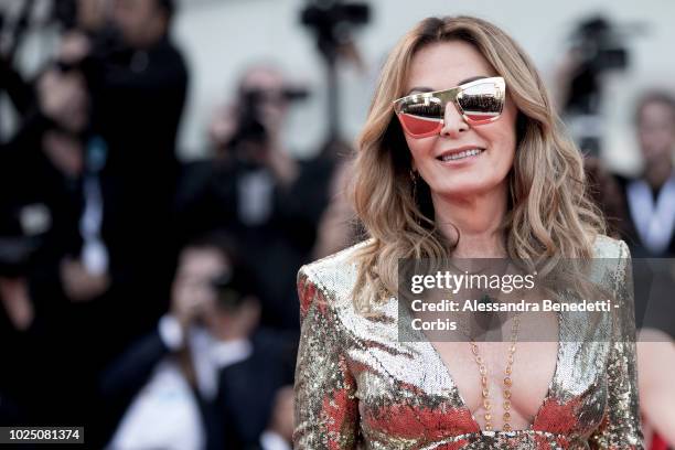 Daniela Santanche walks the red carpet ahead of the opening ceremony and the 'First Man' screening during the 75th Venice Film Festival at Sala...