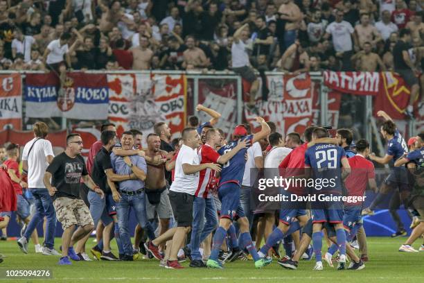 Players of Red Star Belgrade celebrate with their fans after the UEFA Champions League match between FC Salzburg and Red Star Belgrade at Red Bull...