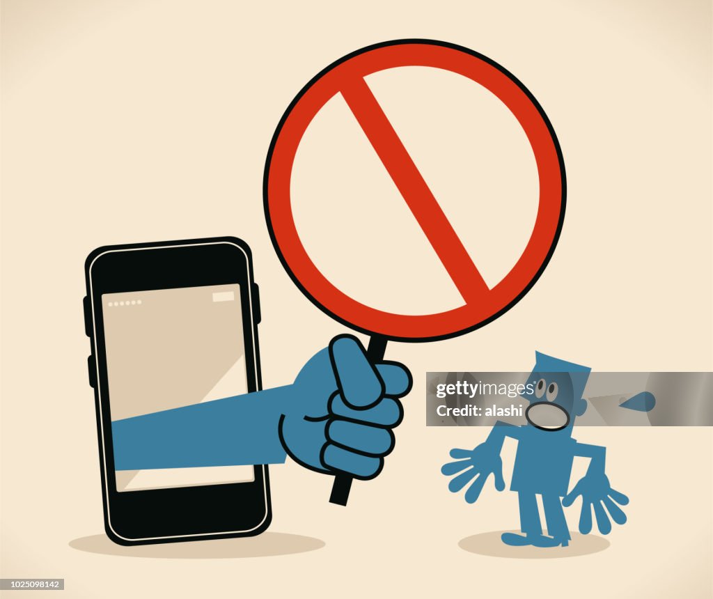 Businessman standing in front of a big smart phone, a big hand from the mobile phone holding an empty prohibition sign