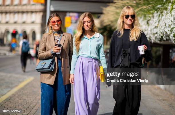 Janka Polliani wearing cropped wide leg denim jeans, brown blazer, blue Loewe bag, Emili Sindlev wearing purple pants, pastel mint top and Jeannette...