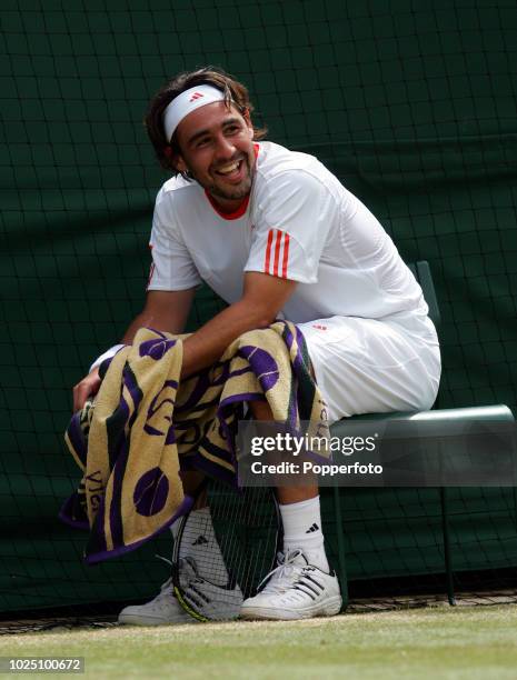 Smiling Marcos Baghdatis of Cyprus during his epic five-set quarter-final loss to Novak Djokovic of Serbia on day eleven of the Wimbledon Lawn Tennis...