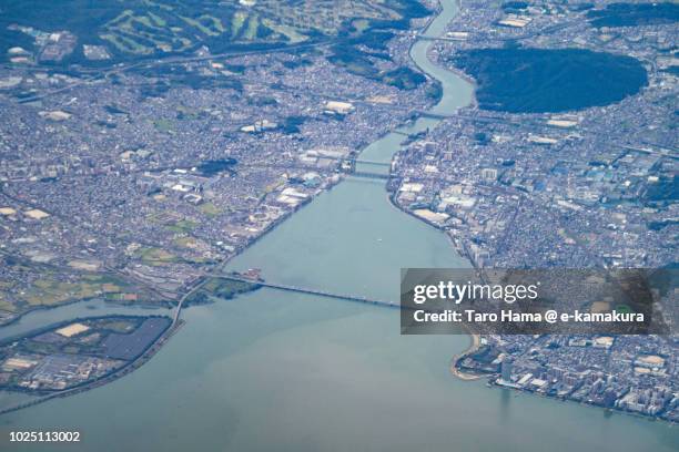 biwa lake in shiga prefecture in japan daytime aerial view from airplane - omi stock pictures, royalty-free photos & images