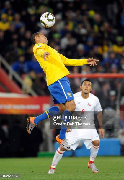 Luis Fabiano of Brazil heads the ball during the 2010 FIFA World Cup South Africa Round of Sixteen match between Brazil and Chile at Ellis Park...