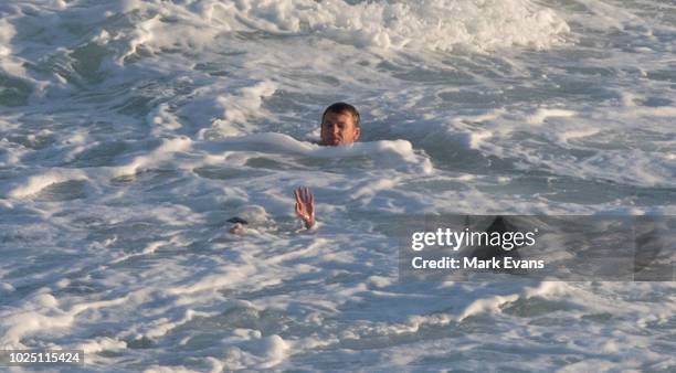 Rescuer swims towards a woman after she was caught in a rip at Bronte beach on August 30, 2018 in Sydney, Australia. The Bureau of Meteorology has...