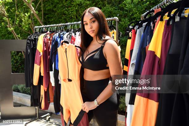 Jordyn Woods attends the launch event of the activewear label SECNDNTURE by Jordyn Woods at a private residence on August 29, 2018 in West Hollywood,...