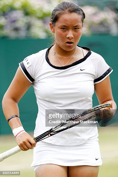 Tara Moore of Great Britain in action during her Girls Singles match against Eugenie Bouchard of Canada on Day Eight of the Wimbledon Lawn Tennis...