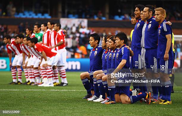 The teams line up for photographs ahead of the 2010 FIFA World Cup South Africa Round of Sixteen match between Paraguay and Japan at Loftus Versfeld...