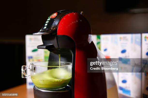 Nestle Japan Ltd. Nutrient-boosted green tea is dispensed into a glass in an arranged photograph taken in Tokyo, Japan, on Thursday, Aug. 22, 2018....