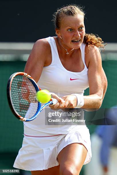 Petra Kvitova of Czech Republic plays a shot during her Quarter Final match against Kaia Kanepi of Estoniaon Day Eight of the Wimbledon Lawn Tennis...