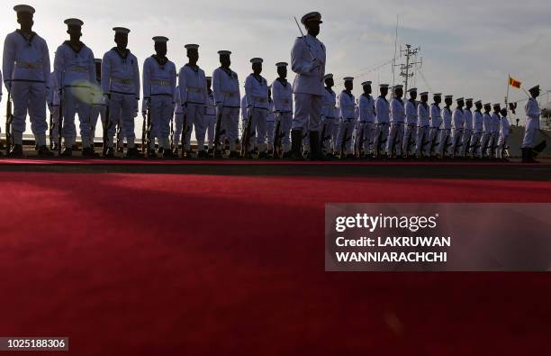 In this photo taken on August 29, 2018 shows Sri Lankan navy personnel stand guard during a ceremony commissioning two naval patrol boats Japan...