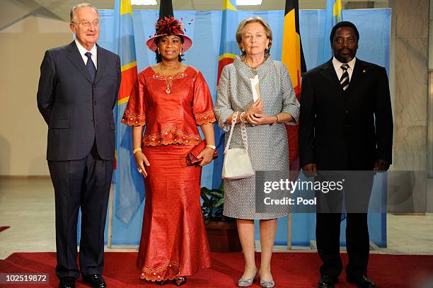 King Albert and Queen Paola of Belgium pose for a photo with and First Lady of Congo Olive Kabila and President of Congo Joseph Kabila at the Palais...