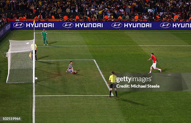 Oscar Cardozo of Paraguay celebrates after scoring his penalty to win his team a penalty shoot-out during the 2010 FIFA World Cup South Africa Round...