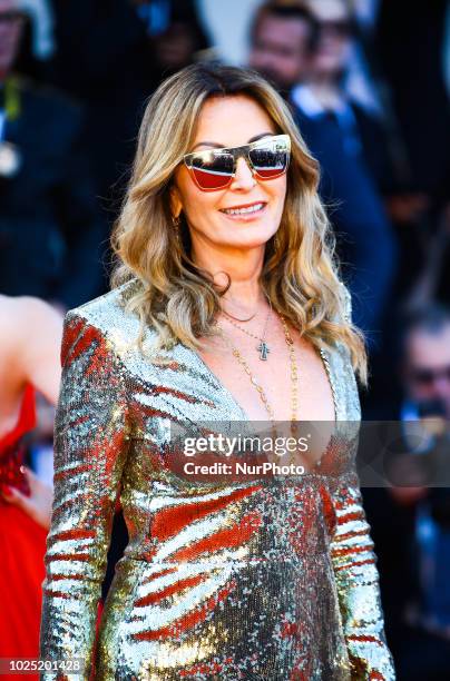 Daniela Santanche walk the red carpet ahead of the opening ceremony and the 'First Man' screening during the 75th Venice Film Festival, in Venice,...