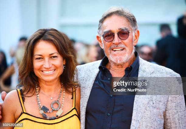 Fabio Testi walk the red carpet ahead of the opening ceremony and the 'First Man' screening during the 75th Venice Film Festival, in Venice, Italy,...