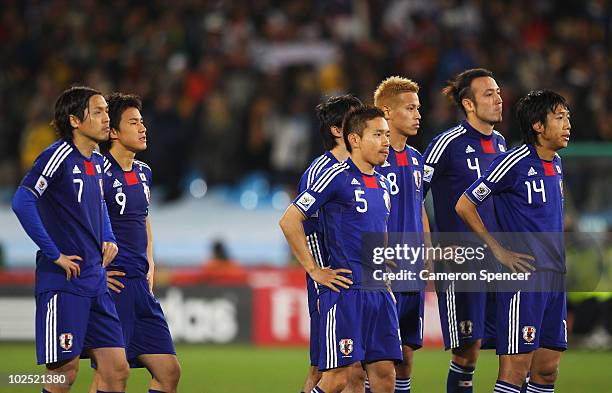 The dejected Japan team as Oscar Cardozo of Paraguay scores the winning penalty that sends Japan out of the tournament during the 2010 FIFA World Cup...