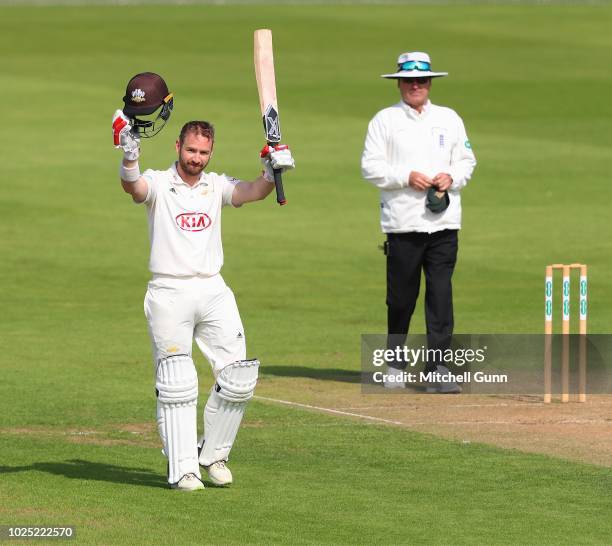 Mark Stoneman of Surrey celebrates scoring a century during day two of the Specsavers County Championship match between Surrey and Nottinghamshire at...