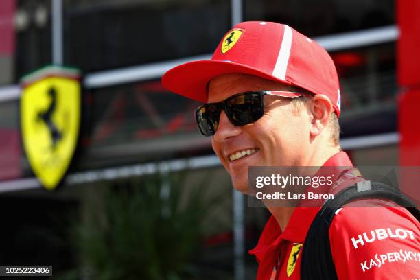 Kimi Raikkonen of Finland and Ferrari looks on in the Paddock during previews ahead of the Formula One Grand Prix of Italy at Autodromo di Monza on...