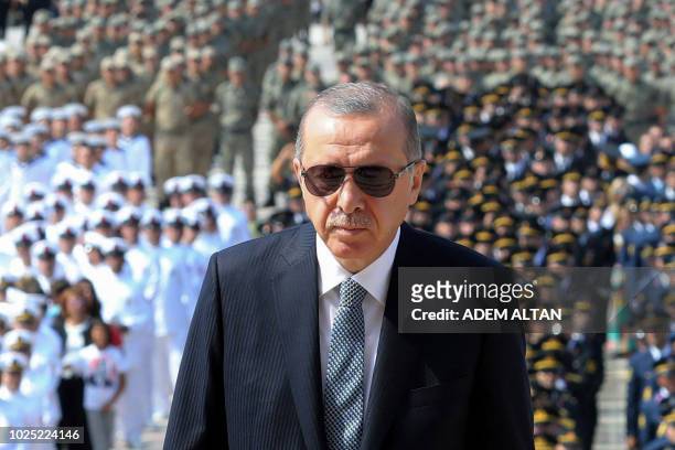 Turkish President Recep Tayyip Erdogan visits the Mausoleum of Mustafa Kemal Ataturk, founder of modern Turkey, during a ceremony marking the 96th...