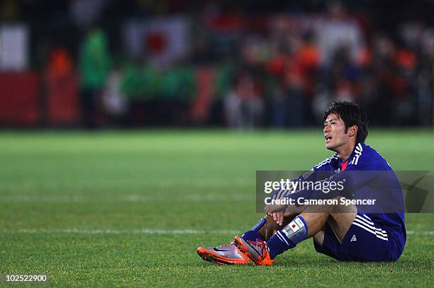 Dejected Keiji Tamada of Japan after they lose a penalty shootout and go out of the tournament during the 2010 FIFA World Cup South Africa Round of...