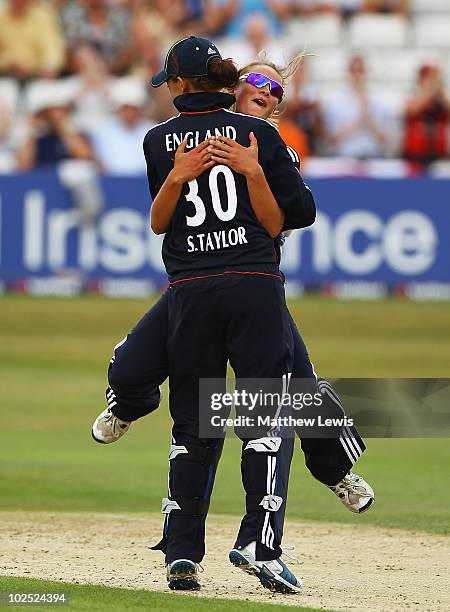 Danielle Wyatt celebrates with Sarah Taylor, after she stumped Maria Fahey of New Zealand during the 1st Women's NatWest Twenty20 International match...