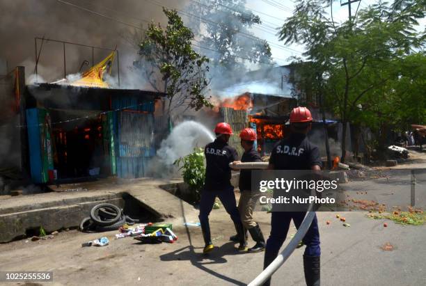 Firefighters douse a fire at a residential area of Ulubari in Guwahati, Assam, India on Thursday, Aug 30, 2018.