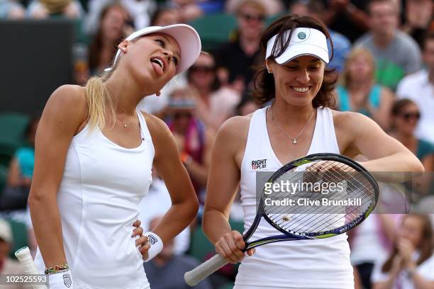 Anna Kournikova of Russia sticks out her tongue next to Martina Hingis of Switzerland during their Ladies Invitational doubles match against Anne...