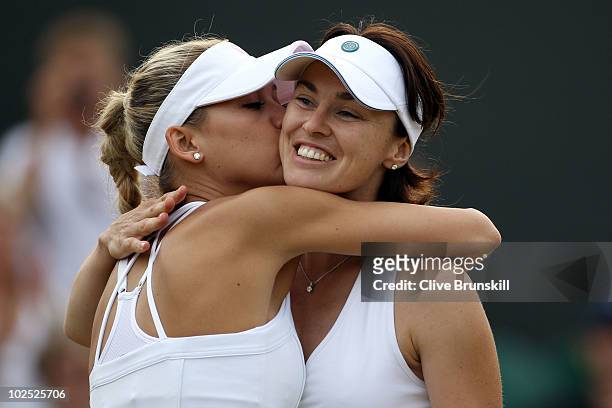 Anna Kournikova of Russia kisses Martina Hingis of Switzerland during their Ladies Invitational doubles match against Anne Hobbs and Samantha Smith...