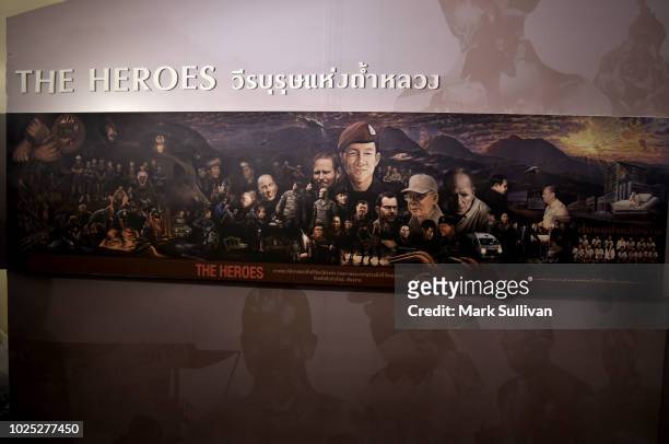 The portrait of rescue members is seen in the interactive exhibition on the Thai Cave rescue operation at the Siam Paragon shopping mall on August...