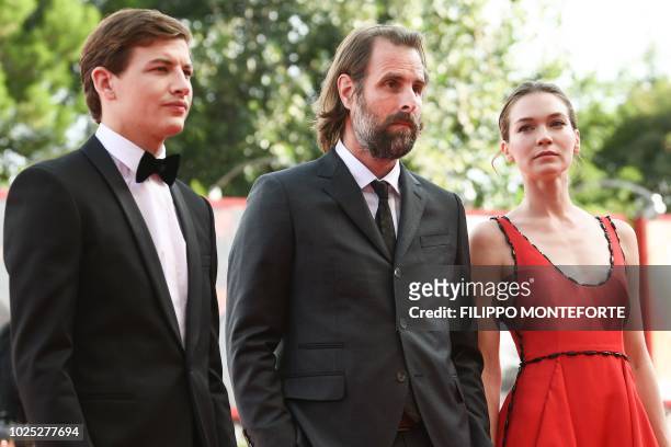 Actor Tye Sheridan, director Rick Alverson and actress Hannah Gross arrive for the premiere of the film "The Mountain" presented in competition on...