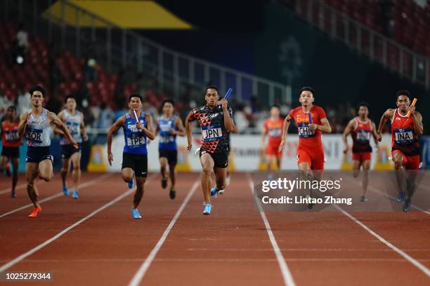 Aska Cambridge of Japan wins the final of the men's 4x100m relay athletics event on day twelve of the Asian Games on August 30, 2018 in Jakarta,...