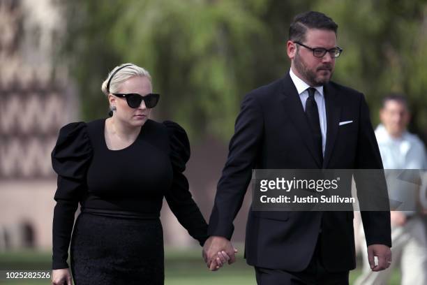 Meghan McCain walks with her husband Ben Domenech as the casket of U.S. Sen. John McCain leaves the Arizona State Capitol to go to a memorial service...