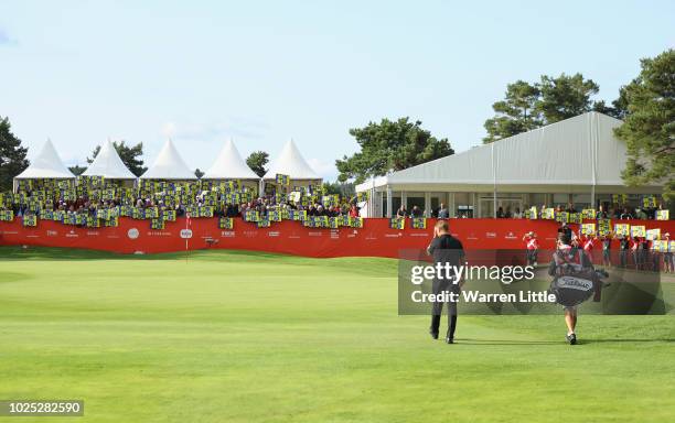 Robert Karlsson of Sweden arrives on the 18th green to a crowd recognition to his 600th appearence on tour during day one of the Made in Denmark...