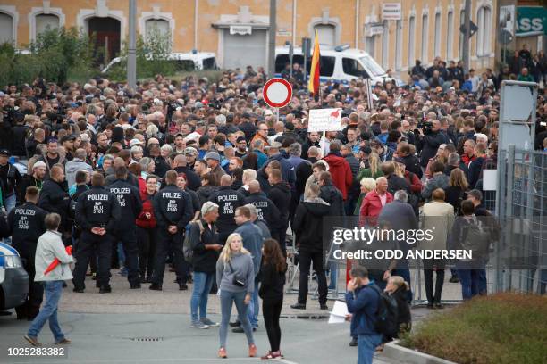 The far-right group "Pro Chemnitz" stage a protest at the entrance to the stadium of Chemnitz FC, where Minister President of Saxony, Michael...