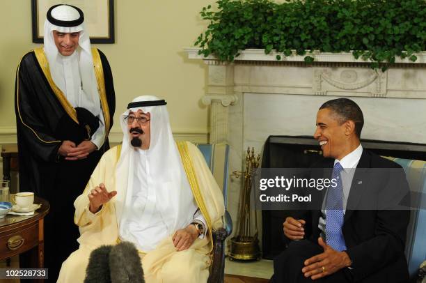 President Barack Obama and Saudi Arabian King Abdullah Bin-Abd-al-Aziz Al Saud laugh as they speak to the media after their meeting in the Oval...