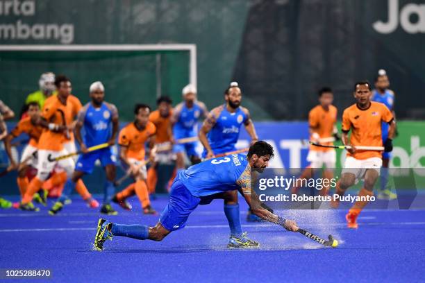 Rupinder Pal Singh of India shoots during Men's Hockey Semifinal match between Malaysia and India at GBK Senayan on day twelve of the Asian Games on...