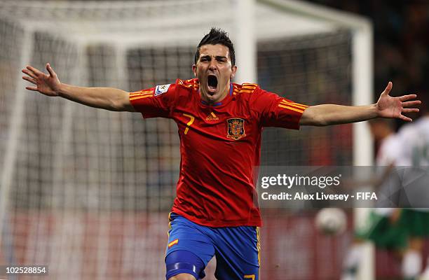 David Villa of Spain celebrates scoring the opening goal during the 2010 FIFA World Cup South Africa Round of Sixteen match between Spain and...
