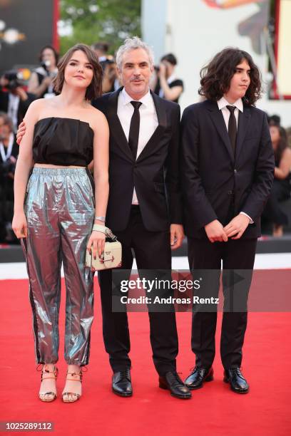 Tess Bu Cuarón, Alfonso Cuarón and Olmo Teodoro Cuarón walk the red carpet ahead of the 'Roma' screening during the 75th Venice Film Festival at Sala...