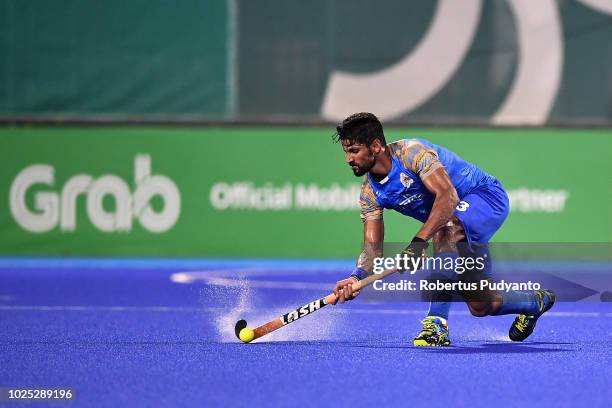 Rupinder Pal Singh of India shoots during Men's Hockey Semifinal match between Malaysia and India at GBK Senayan on day twelve of the Asian Games on...