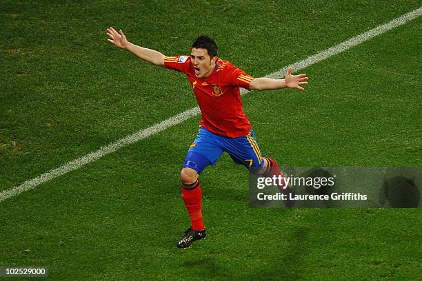 David Villa of Spain celebrates scoring the opening goal during the 2010 FIFA World Cup South Africa Round of Sixteen match between Spain and...