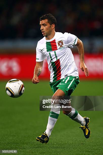 Simao of Portugal runs with the ball during the 2010 FIFA World Cup South Africa Round of Sixteen match between Spain and Portugal at Green Point...