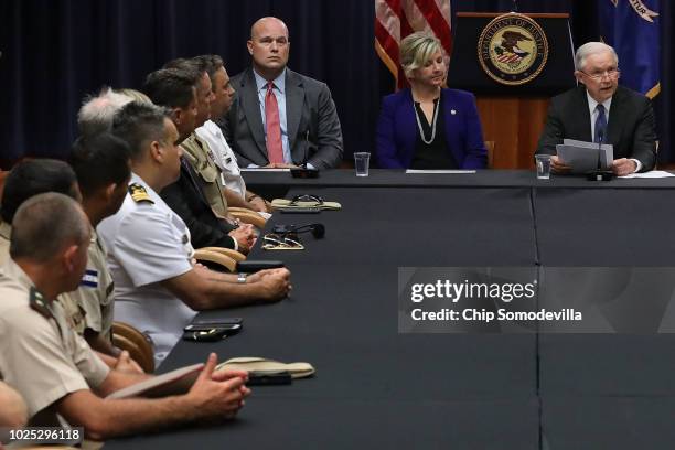 Department of Justice Chief of Staff Matt Whitaker, the FBI's Kristi Johnson and U.S. Attorney General Jeff Sessions participate in a round table...