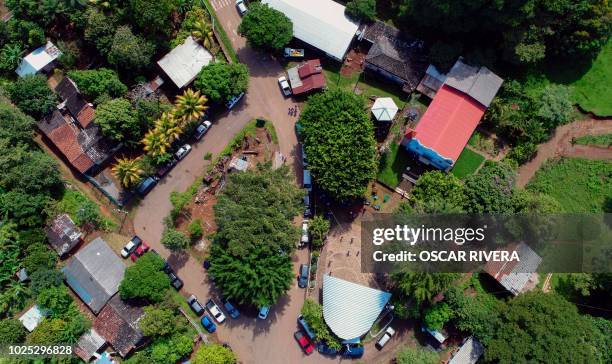 Aerial view of the village of El Mozote, 200 km east of San Salvador, on August 30, 2018. - Judges of the Inter-American Court of Human Rights ,...