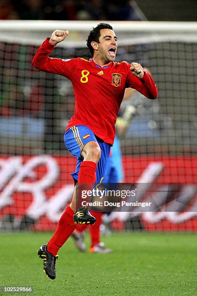 Xavi Hernandez, captain of Spain, celebrates victory following the 2010 FIFA World Cup South Africa Round of Sixteen match between Spain and Portugal...