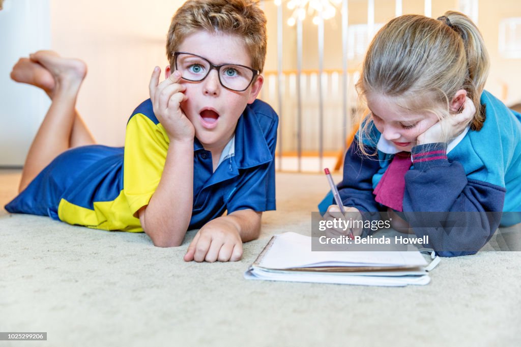 Australian School Children In Their Uniform Completing Homework On The ...