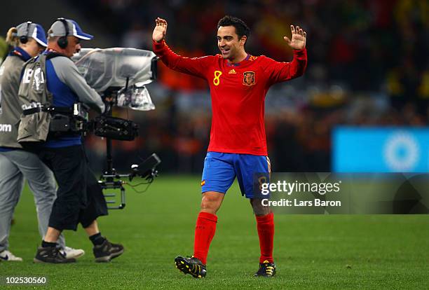 Xavi Hernandez, captain of Spain, celebrates victory following the 2010 FIFA World Cup South Africa Round of Sixteen match between Spain and Portugal...