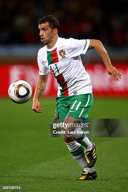 Simao of Portugal runs with the ball during the 2010 FIFA World Cup South Africa Round of Sixteen match between Spain and Portugal at Green Point...
