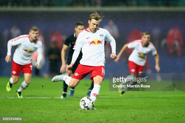 Emil Forsberg of Leipzig scores his team's third goal from the penalty spot during the UEFA Europa League Qualifying Play-Off second leg match...