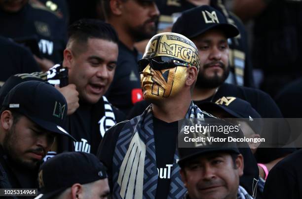 Los Angeles FC fan shows his support with painted team logos on his head and face prior to the MLS match between Los Angeles FC and the Los Angeles...