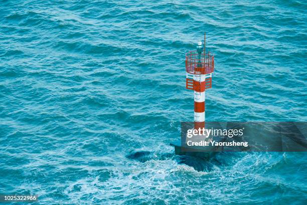 navigation beacon in sea - red beacon stock pictures, royalty-free photos & images